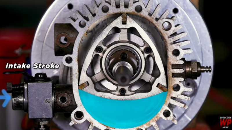 Illustration for article titled Watch A Wankel Rotary Engine’s Beautiful Explosions Through A Transparent Housing